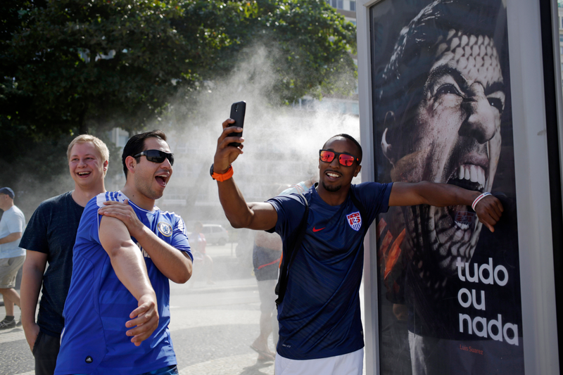 Illustration for article titled People In Rio Are Doing Funny Things With A Luis Suárez Billboard